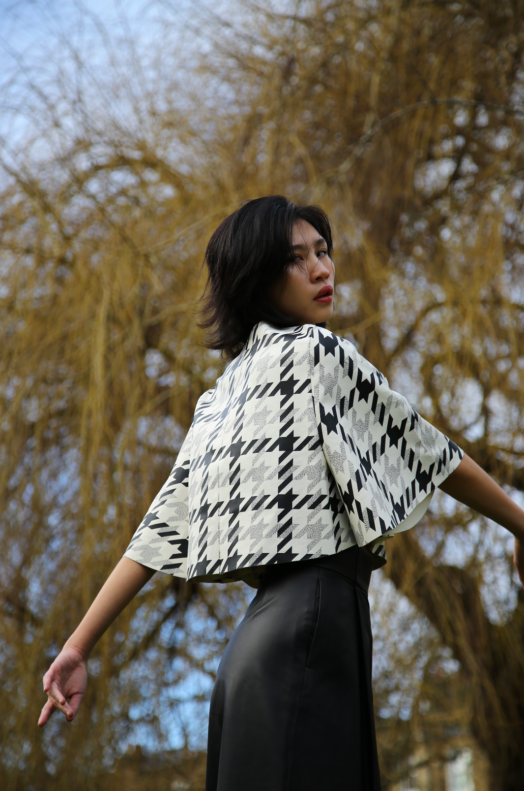 houndstooth leather cape top leather black wide-leg trouser womenswear skiim paris fashion